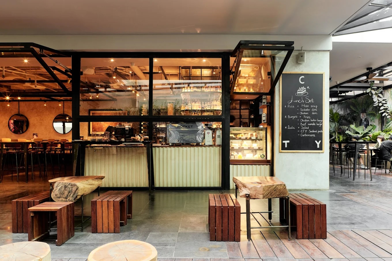 The space at CTY Kitchen + Bar makes the most of natural light, featuring a warm, earthy brown color palette